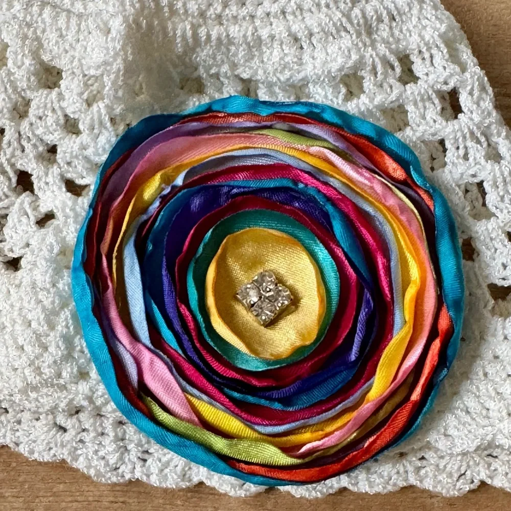 White‎ Crochet Baby Hat With Multicolor Satin Flower Appliqué